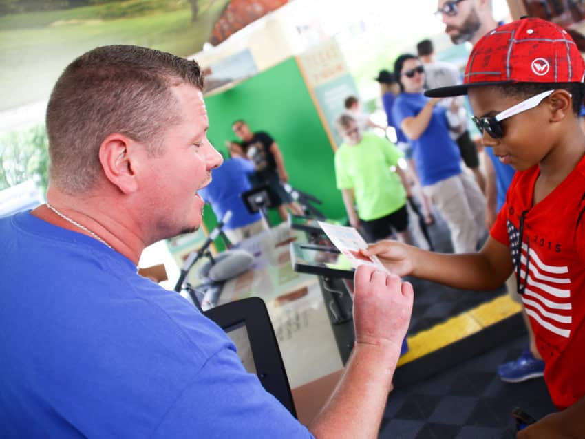 Brand Ambassador talking with guest at Ohio State Fair